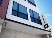 Thumbnail 20 of 36 - Property entrance sign and modern building facade at 68 Beale Apartments, Quincy, MA 02169